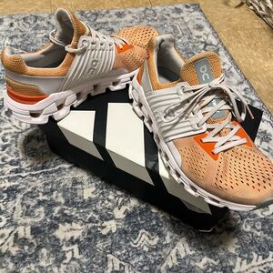 On Running Peach and White Athletic Shoes